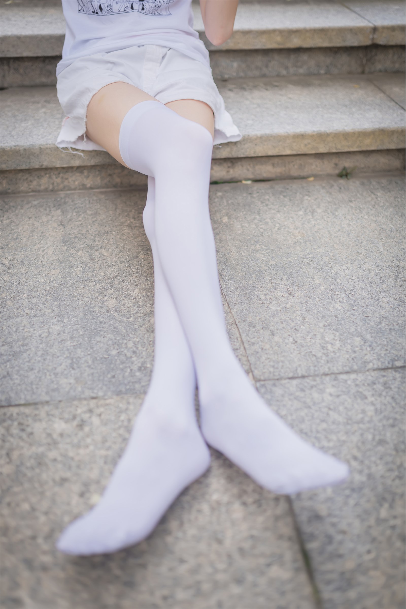 Rabbit plays with painted white stockings over the knee(3)